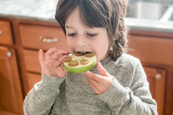 Child enjoying turtle snack