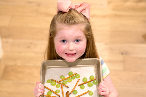 Preschooler showing off finished snack