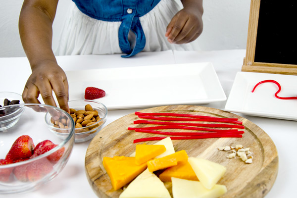 Young girl assembling snack