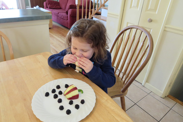 Preschooler eating sandwich