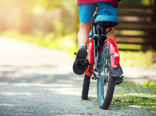child riding a bicycle