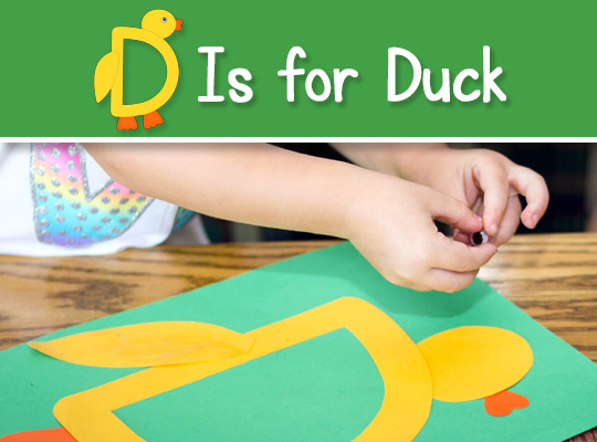 child assembling D Is for Duck craft