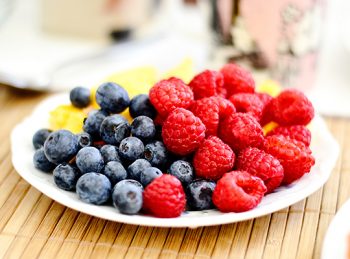plateful of blueberries and raspberries