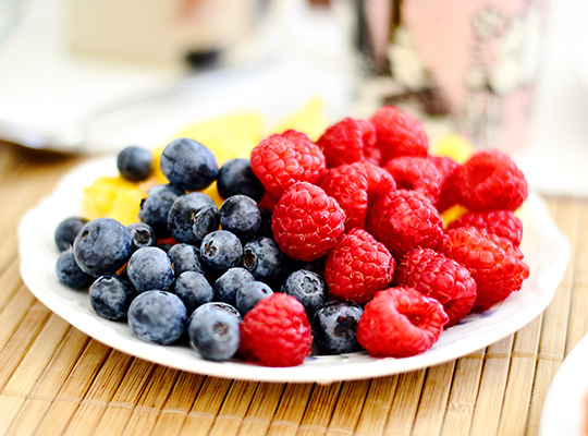 plateful of blueberries and raspberries