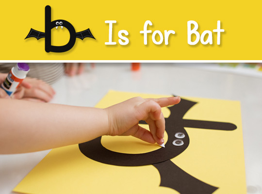 child assembling her lowercase letter b craft