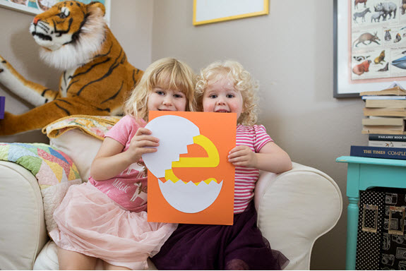 children show off their lowercase e craft