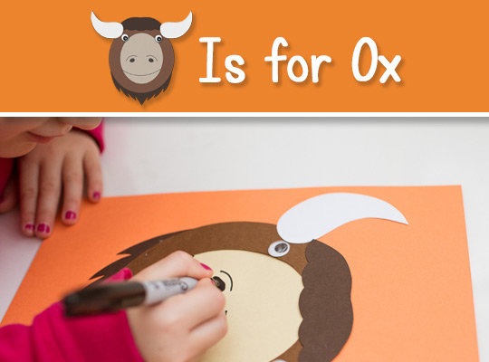 child draws mouth on uppercase o craft