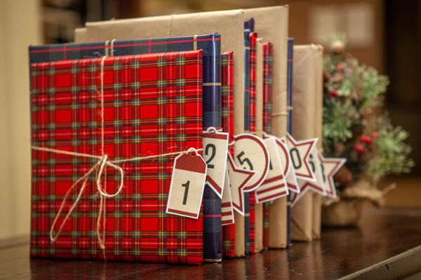 wrapped books with book advent calendar tags