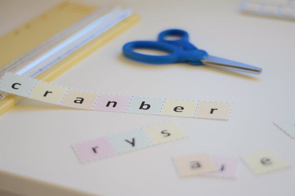 cutting up letter squares for Thanksgiving Scramble