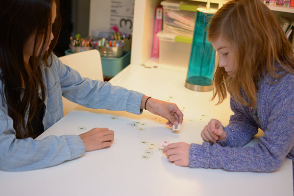girls create an acrostic with Thanksgiving Scramble letters
