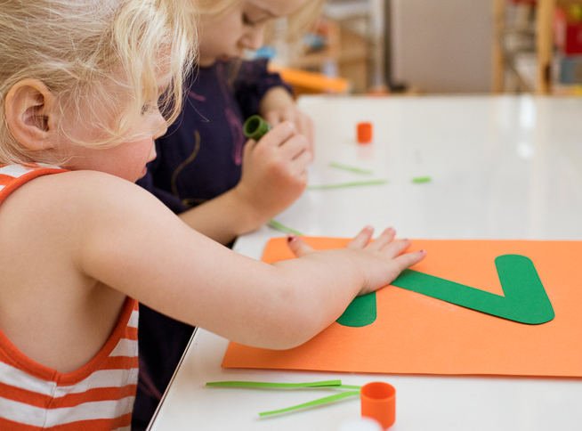 child works on her lowercase z craft