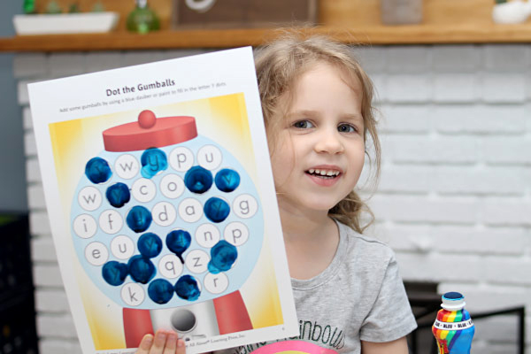 little girl shows her letter Y activity