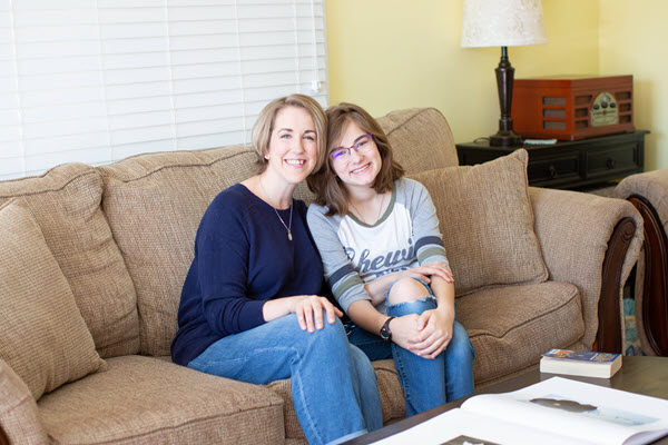 mom and teenager on the couch