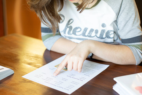 teen reading from fluency sheet