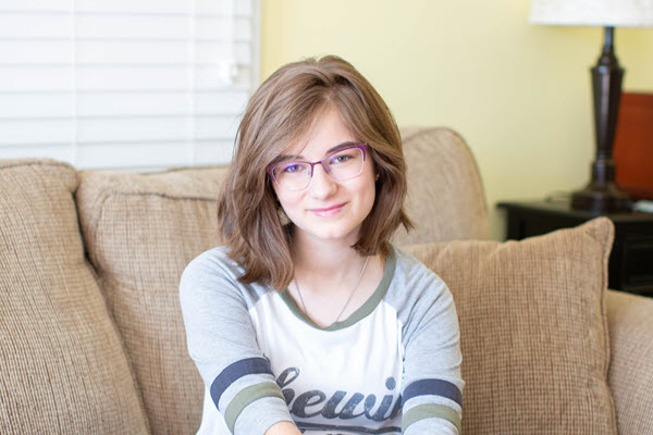 young woman sitting on a couch