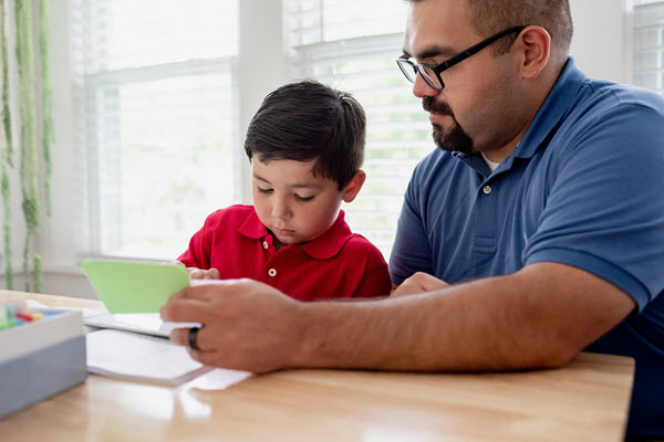 father and son learning together