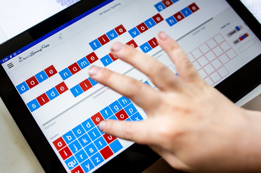 Child using the Letter Tiles app